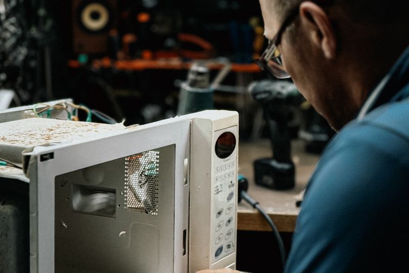 Microwave Repair — residential microwave being serviced